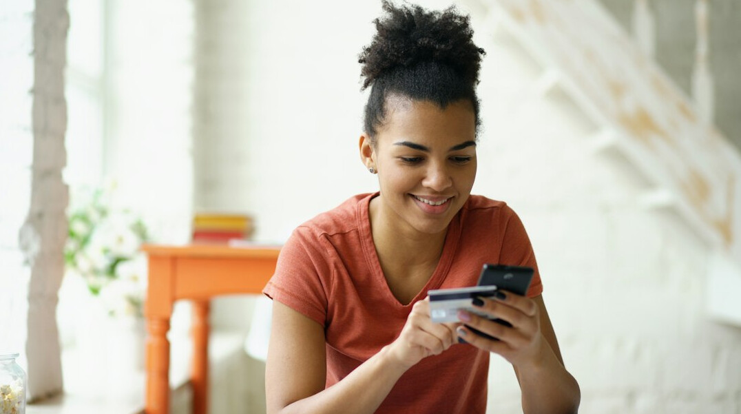 woman entering numbers in budget app