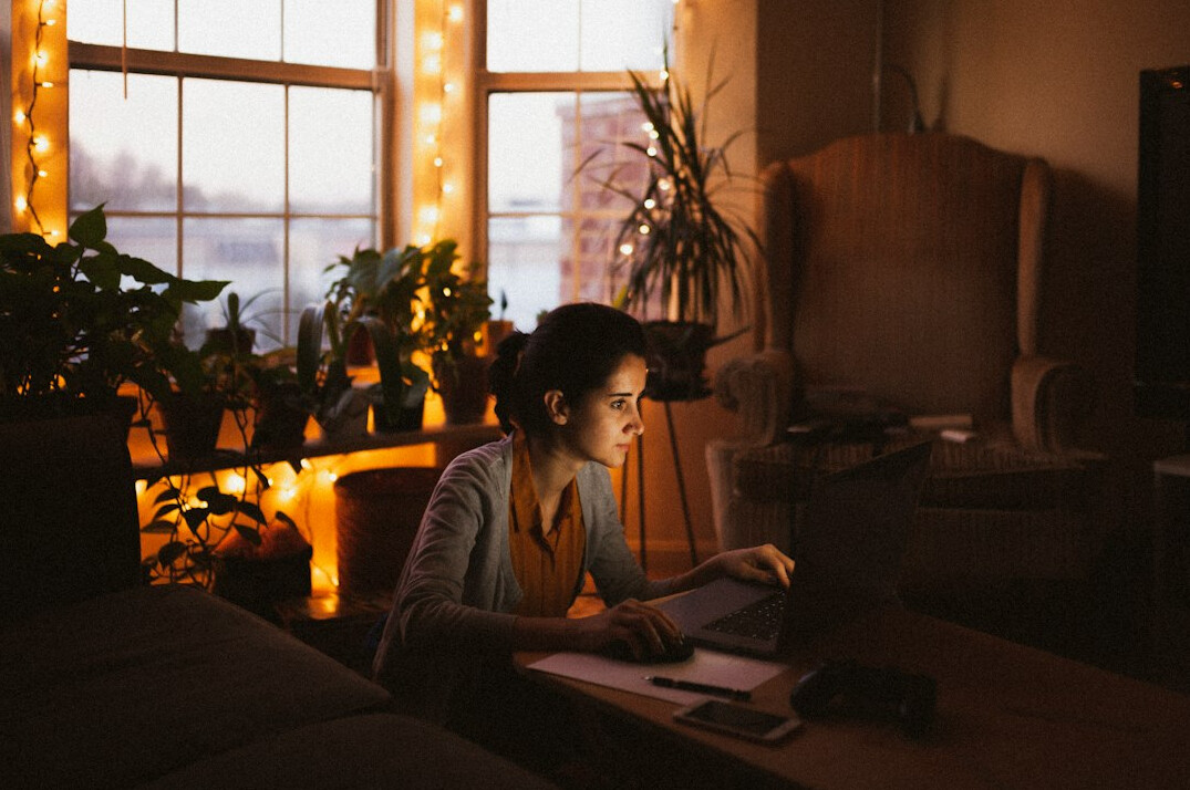 person calculating budget at home