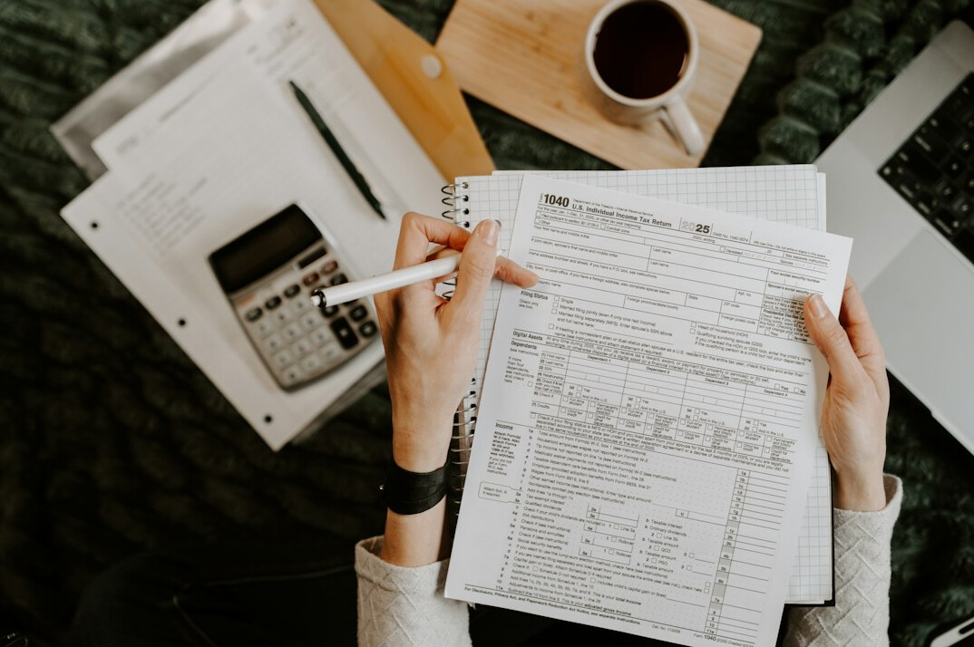person budgeting with calculator